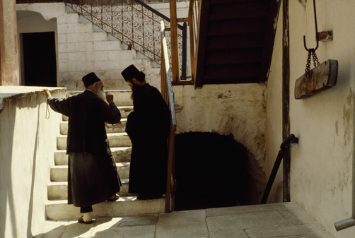 An elder monk counsels a younger monk.